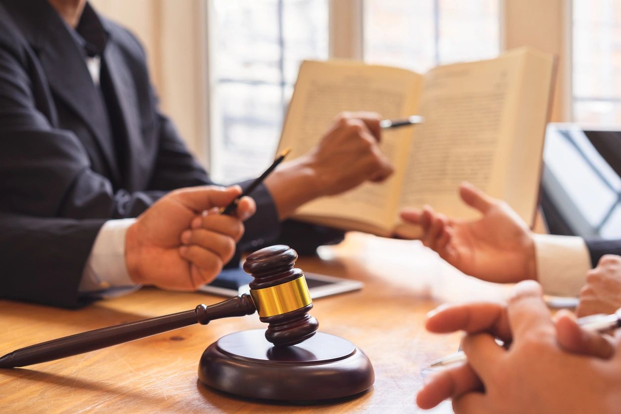 Gavel during lawyer consultation meeting